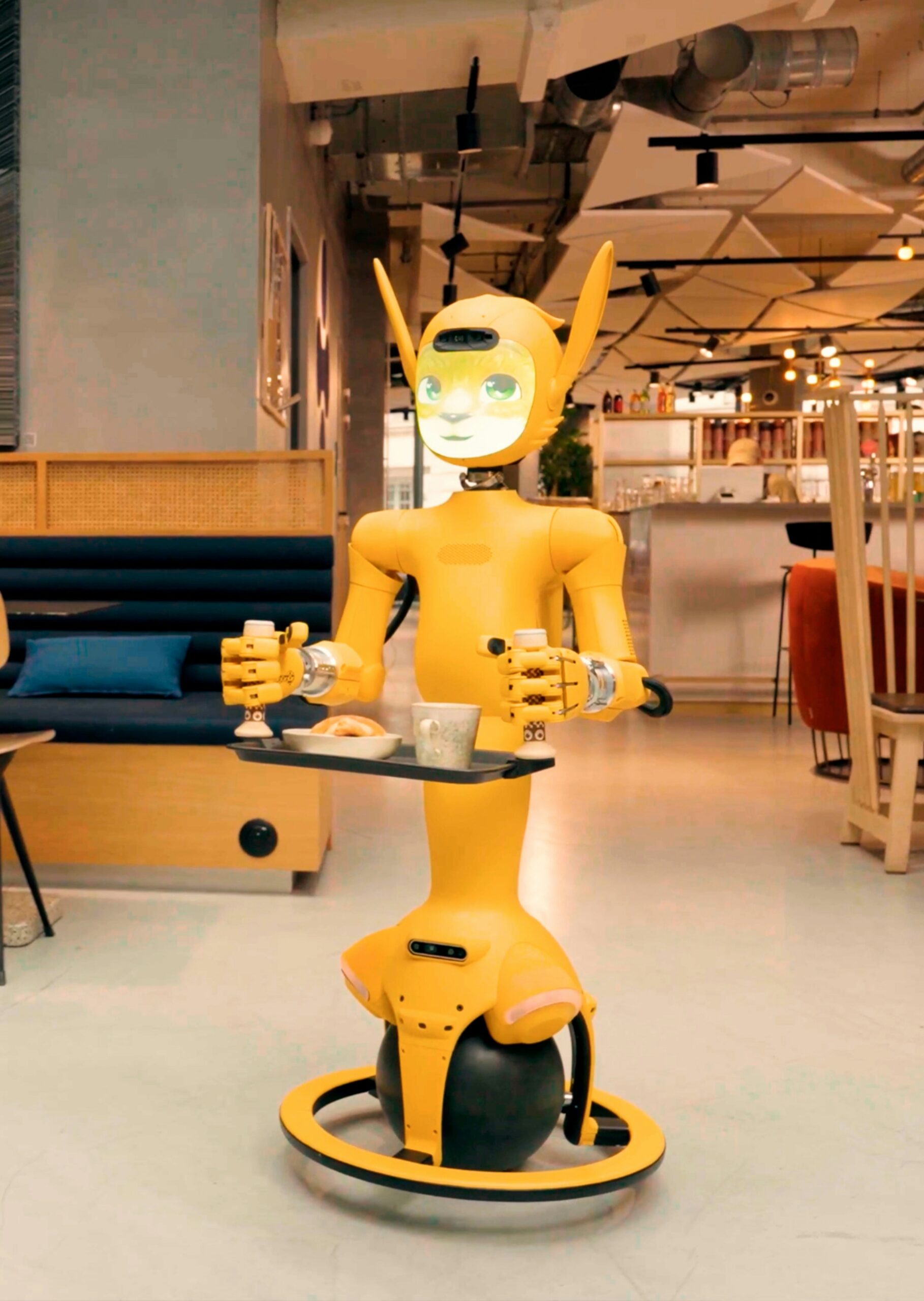 Robot serving tea in cafeteria.